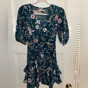 Francesca’s dark green floral dress